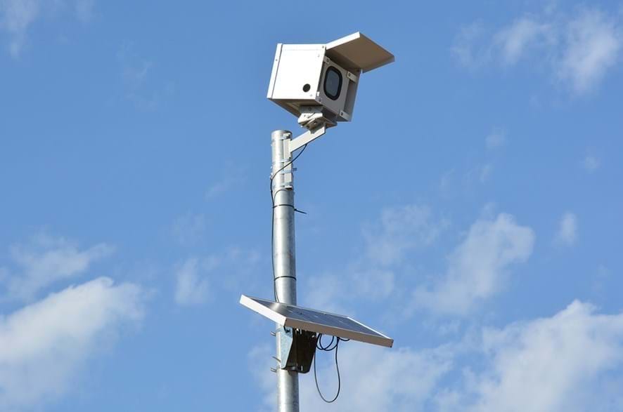 Time-lapse camera lowerable tilt pole